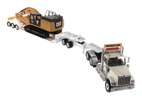 1:50 International HX520 Tandem Tractor + XL 120 Trailer outriggers, White w  Cat®349F L XE Hydraulic Excavator loaded including both rear boosters and front jeep, Transport Series, 85600 ***INCOMING MAY For Sale